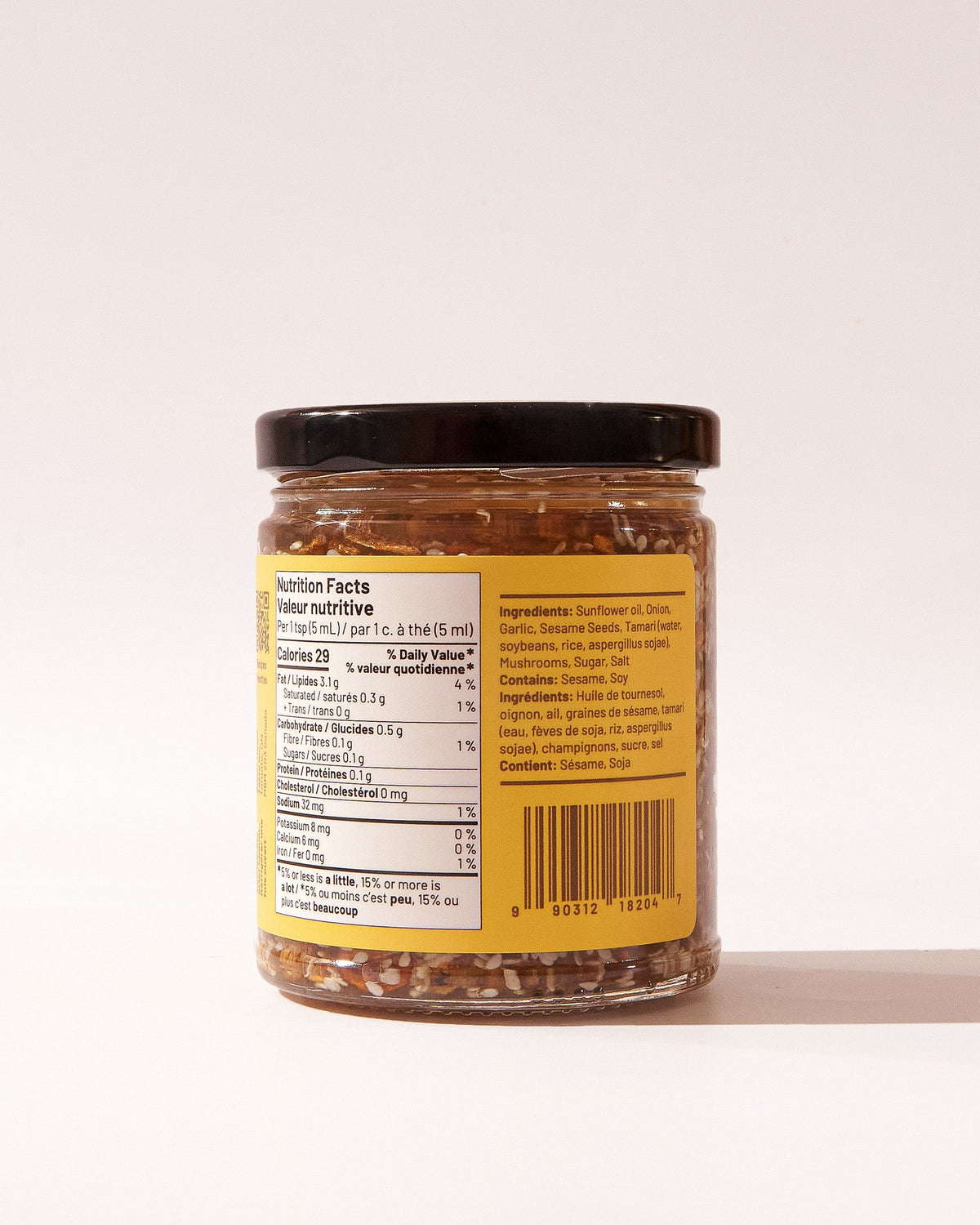 The back of a Super Magic Taste Chili Crisp jar, showing the nutrition facts, ingredients and allergens